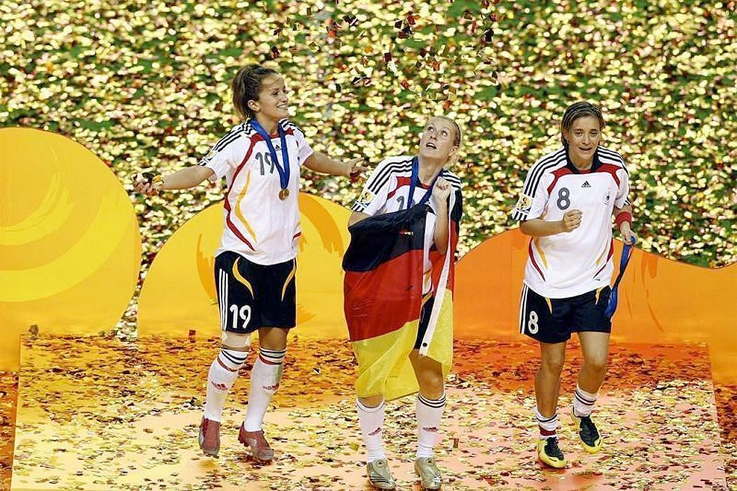 German players celebrating the 2007 FIFA Women's World Cup victory after beating Brazil in the final